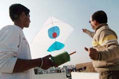 Kite fans try to fly a kite in Amritsar