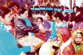 Students of Spring Dale School enjoy the goodies being distributed at a Lohri function in the school