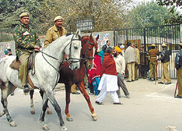 Security personnel keeping a vigil at a polling booth in Tilak Vihar as people cast their vote for Delhi Sikh Gurdwara Management Committee election on Sunday.