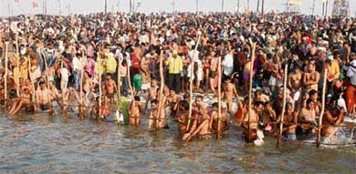 Devotees take a holy dip and offer prayers at Sangam in Allahabad on Sunday during the Ardh Kumbh Mela