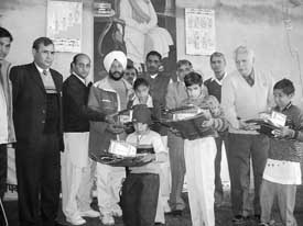 Members of the NGO, Disha, distributing material among special children at Fatehabad recently