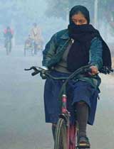 A girl cycles to school in Chandigarh on Monday