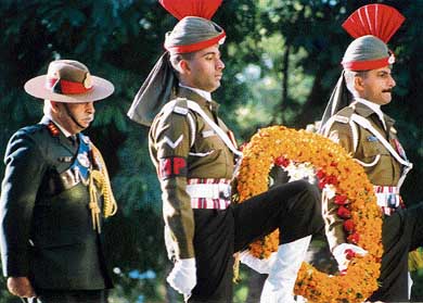 Army men carry a wreath to be laid at the Veer Smriti in Chandi Mandir on Monday