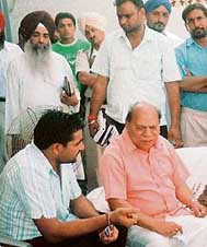 Sarpanch Tejinder Singh with Punjab minister Chaudhary Jagjit Singh at Nijjaran village.