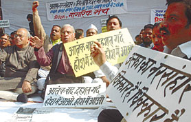Activists sitting on dharna under the banner of Nagarik Manch against the gruesome killings committed by ULFA, at Jantar Mantar in the Capital on Tuesday.