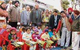 Children of convicted mothers at the school flanked by Lion Club office-bearers and DIG Jatinder Kumar Jain.