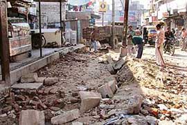 A road dug to develop a footpath on Gaushala Road in Ludhiana on Tuesday. 