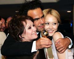 `Babel' director Alejandro Gonzalez Inarritu (centre), Japanese actress Rinko Kikuchi (right) and Spanish actress Adriana Barraza arrive at the Paramount party after the 64th Annual Golden Globe Awards in Beverly