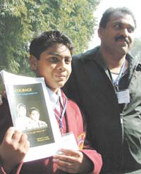 Master Micheal George from Raghu Nagar in Delhi, a winner of National Bravery Awards 2006, along with his father, at a press conference in the Capital