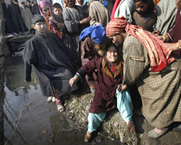 Women try to console a relative of Rayees Ahmad Dar, a militant killed in an encounter, during his funeral in Kulgam, 70 km south of Srinagar, on Thursday.