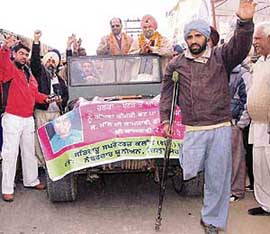 Mr Tirlochan Singh (garlanded) and his supporters in Kharar on Thursday. 