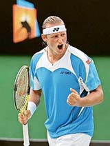 Argentinas David Nalbandian exults during his second-round match against Ecuadors Nicolas Lapentti at the Australian Open