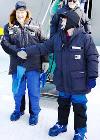 Former mountaineer Sir Edmund Hillary (left) shakes hands with New Zealand's Prime Minister Helen Clark after arriving at Scott Base in the Antarctic