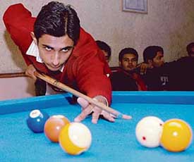 Sumeer aims to pot the ball during the N.K. Memorial 9-Ball Open Prize Money Tournament at the Chandigarh Billiards Coaching Centre, Sector 22, on Saturday. 
