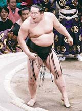 Mongolias Asashoryu rejoices after defeating Ozeki Tochiazuma in the title bout of the New Year Grand Sumo Tournament in Tokyo