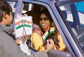 With a few days to go for Republic Day, a boy is selling Tricolour to a motorist at the Sector 17 lightpoint in Chandigarh