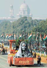 A tableau of Delhi on womens power is displayed during a full dress rehearsal for the Republic Day celebrations in the Capital on Tuesday