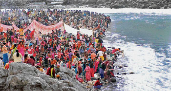 Pilgrims take a dip on Makar Sankranti in Tattapani which will soon be submerged in the Kol dam.