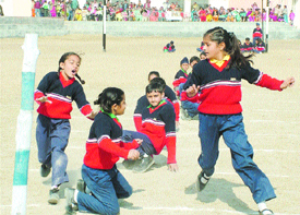 Students of Eklavya School play kho-kho during sports day organised in Jalandhar.