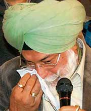 Bir Devinder Singh breaks down at a Press conference in Mohali on Thursday.