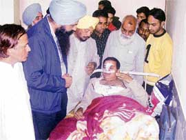 SAD leader Jagjit Singh Talwandi calls on Surinder Singh Mahant at the Civil Hospital, Raikot, on Saturday.