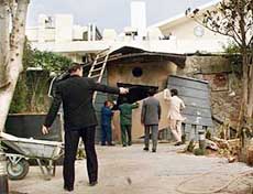 Pakistani workers of Marriott Hotel clear the site of a suicide attack in Islamabad on Saturday. Pakistani investigators are trying to establish the identity of a suicide bomber who attacked a luxury hotel in the capital and suspect Islamist militants were behind it. 