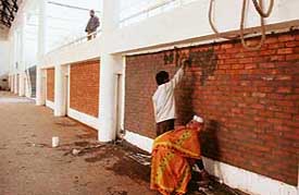 Walls being erected in the multipurpose hall of Guru Nanak Sports Complex, Ludhiana, in preparation for the ensuing Punjab Vidhan Sabha elections.