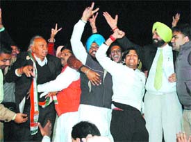 Supporters of Navjot Sidhu and Surinder Singla prevent the contestants from trading blows on the stage during a live TV channel debate on the campus of Khalsa College, Amritsar