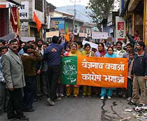 BJP workers march through the streets of Baijnath town on Tuesday in protest against the failure of the Himachal Government in checking the rising prices and deteriorating law and order situation in the state