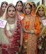 Participants from various colleges in bridal dresses during an inter college 'Beauty Gala' at BD Arya Girls College, Jalandhar Cantt, on Tuesday
