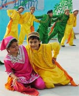Students of Mayor World School Jalandhar, perform a Kashmiri dance during a fete 