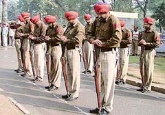 A contingent of the Punjab Police pays tributes to Mahatma Gandhi at a simple ceremony in Mini Secretariat in Ludhiana