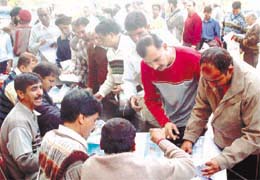 Traders filing their affidavits at the MCD counter in Rajouri Garden on Wednesday.