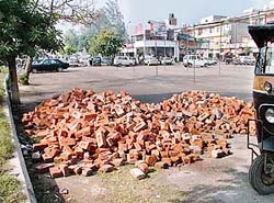 Bricks meant for the construction of a urinal lie in Sarabha Nagar market in Ludhiana