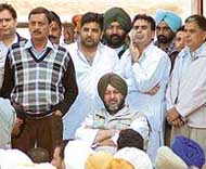 Congress MLA Jasbir Singh Dimpa, booked under the IPC and the Arms Act, along with other leaders at a rally in front of his election office at Beas on Wednesday.