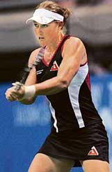 Samantha Stosur returns the ball during her first round match against Vera Zvonareva of Russia in the Pan Pacific Open