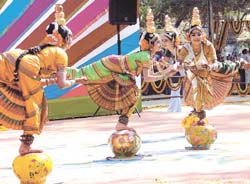 Kuchipudi dancers strike a greeting pose before a performance during the inauguration of 21st Surajkund Crafts Mela in Faridabad.
