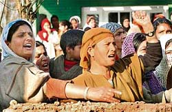 Kashmiri women protest on Thursday in Srinagar against the police after the exhumation of the body of Abdul Rahman Padroo, a carpenter from a village in south Kashmir, who was assumed to be missing by his family