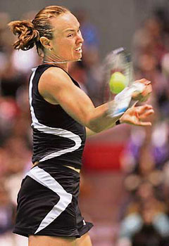Switzerlands Martina Hingis plays a return during her quarterfinal against Australias Samantha Stosur in the Pan Pacific Open in Tokyo on Friday. Hingis won 6-0, 6-1.