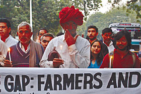Farmers holding a candlelight march against the increasing incidents of suicide at Jantar Mantar in the Capital on Sunday. 