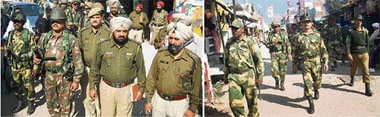 Paramilitary personnel hold a flag march at Baba Bakala (Beas) on Sunday