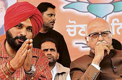 The BJP candidate for the Amritsar Lok Sabha seat, Mr Navjot Singh Sidhu, and senior party leader L.K. Advani at an election rally in Amritsar