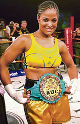 American boxer Laila Ali shows her WBC super-middleweight title belt after knocking out Guyanas Gwendolyn ONeill at the Emperors Palace in Johannesburg on Saturday. 
