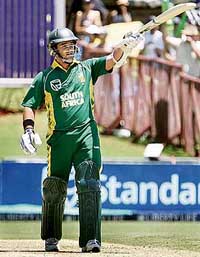 South Africas Mark Boucher celebrates after scoring a half-century during the first one-day match against Pakistan in Johannesburg on Sunday.
