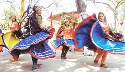 Folk artistes performing at the ongoing Surajkund Crafts Mela