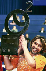 Marcos Baghdatis of Cyprus holds the trophy after beating Croatias Ivan Ljubicic in the final of the Zagreb tennis tournament