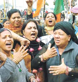 Activists of BJP Mahila Morcha demonstrating against the Congress Government on the issue of price hike, at Connaught Place in the Capital 