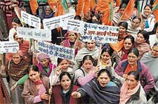 Members of the BJP womens cell protest against the Congress government on various issues near the DC office in Shimla on Friday.