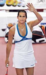 Frances Amelie Mauresmo acknowledges the crowd after defeating compatriot Nathalie Dechy in the pre-quarterfinal of the WTA Paris Open tennis tournament on Thursday