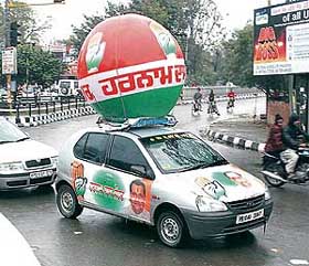 A car painted with the election symbol and picture of a local candidate in Ludhiana.